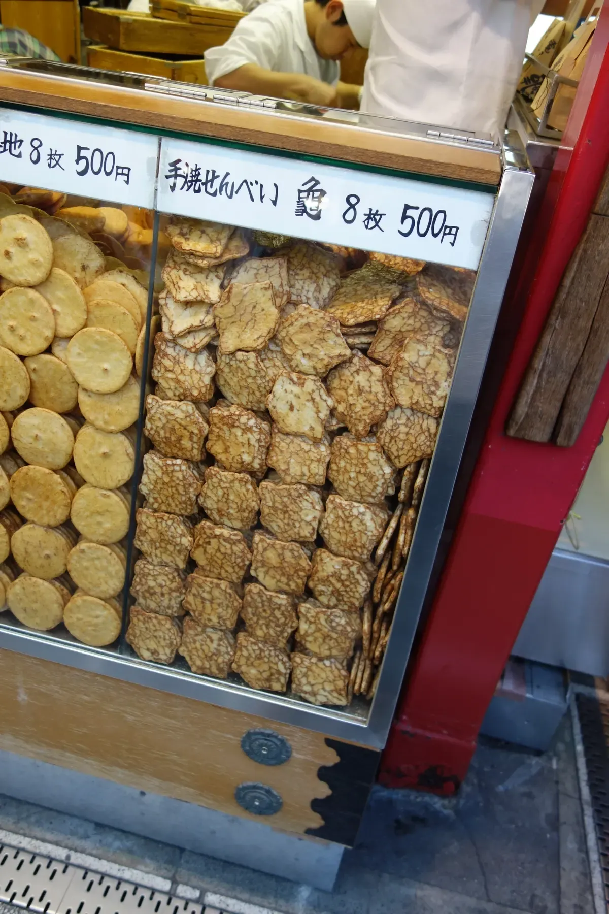 Handmade rice cracker senbei stall on Nakamise Street during an Asakusa food tour Tokyo